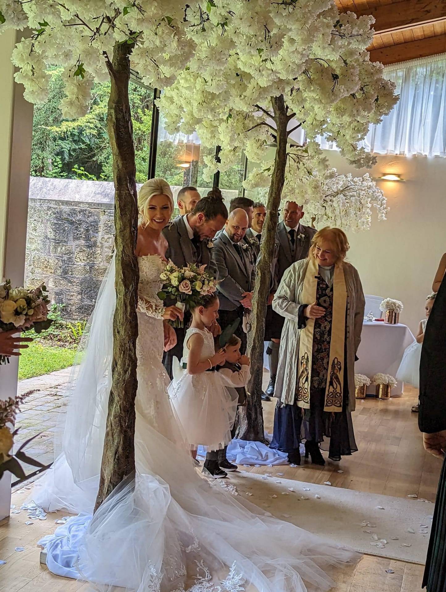 Wedding ceremony under blossom trees